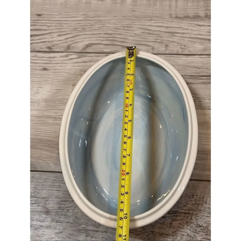 Temp-tations Ovenware by Tara Blue oval covered casserole dish with a metal stan